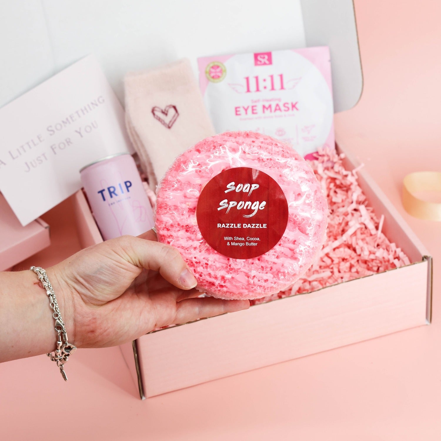 self care gifts – pink pamper box with a self-heating eye mask, chocolate and relaxing bath treats