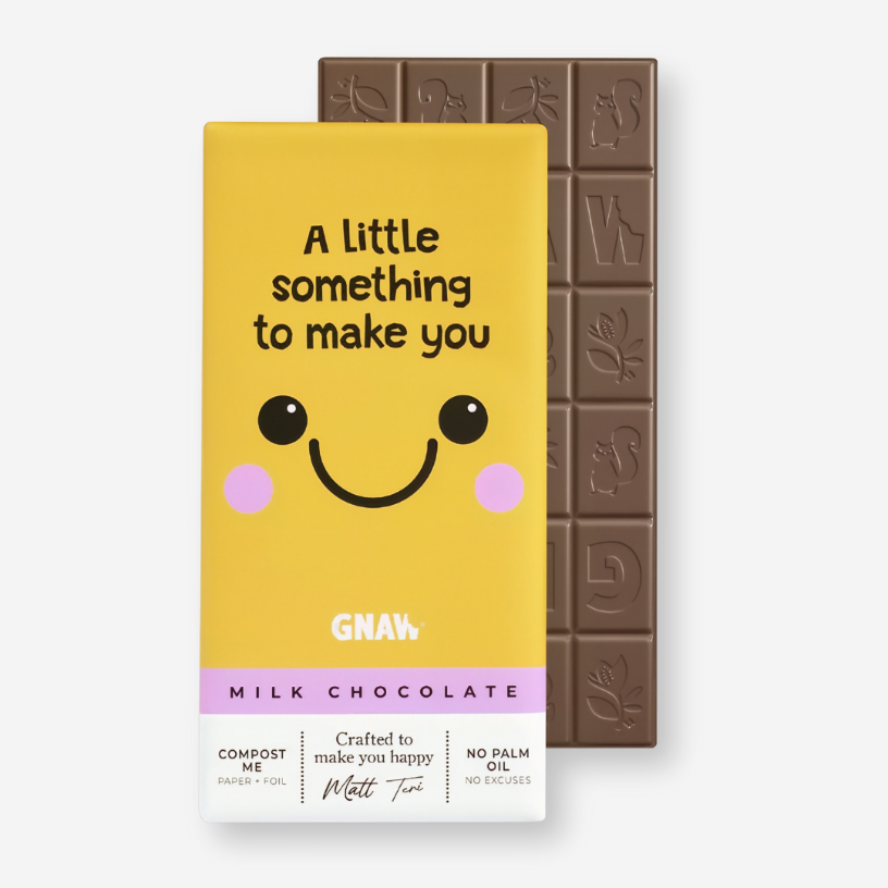 Smile Milk Chocolate Bar with a playful graphic design, featuring a cheerful message in cartoon font, promising a smooth and creamy treat.