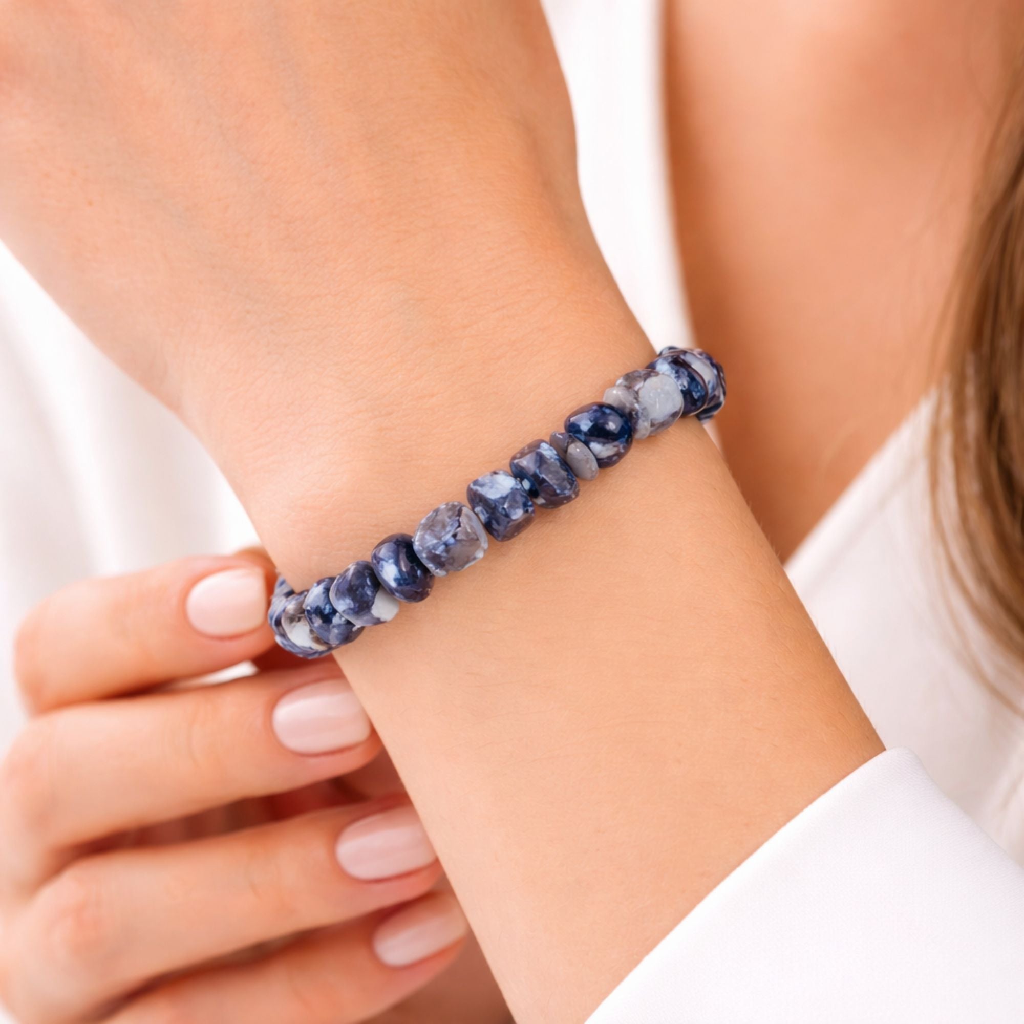 Sodalite crystal chip bracelet worn on wrist, blue natural gemstone stretch bracelet, calming crystal jewellery gift for her, mindfulness bracelet