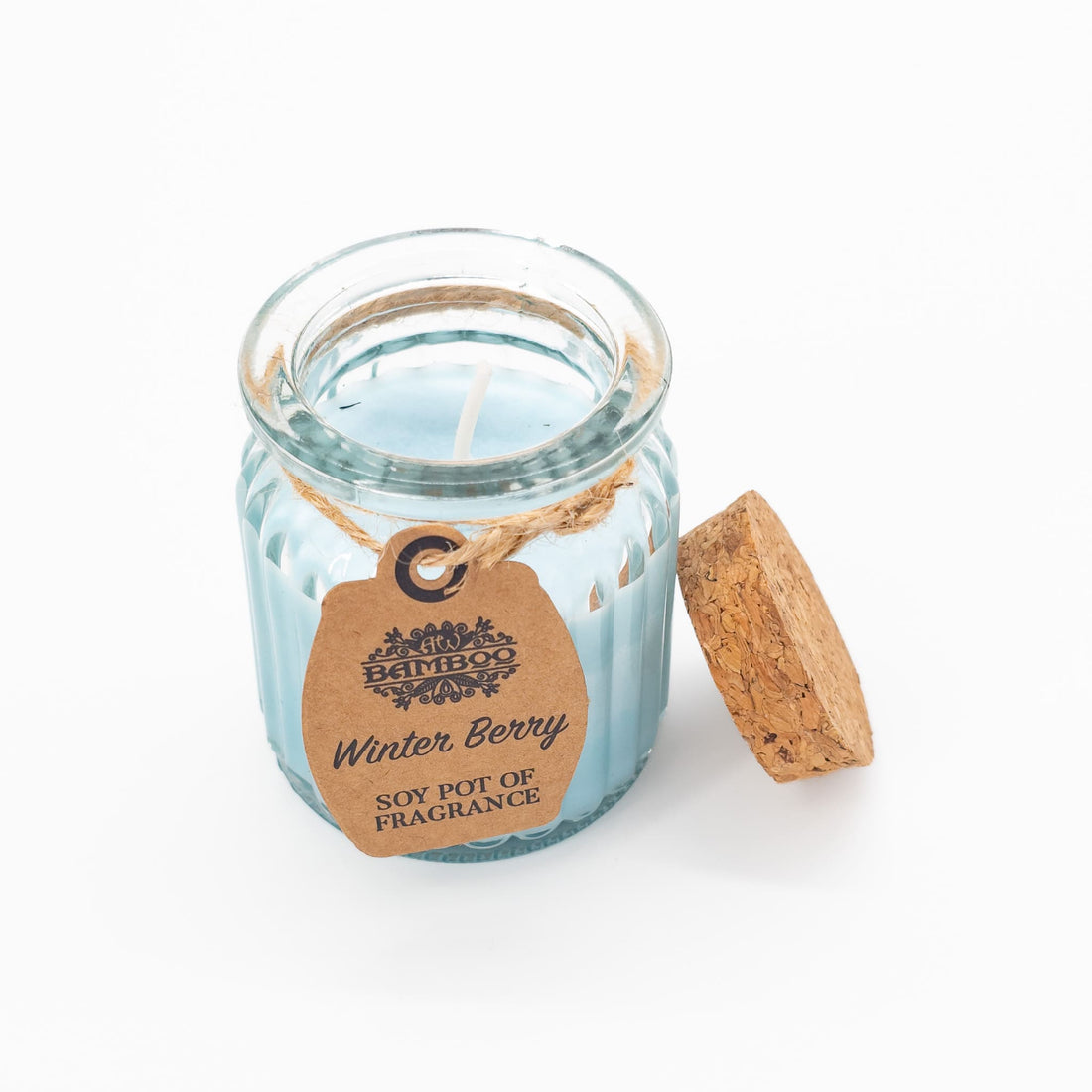 Winter Berry Candle in a jar, featuring a festive scent of sweet and tart winter berries. Size: 7 x 5.5cm, Burn time: Approx 20 hours.