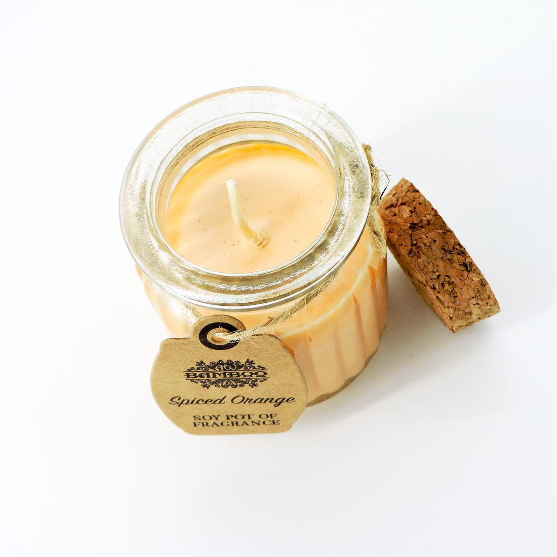 Spiced Orange Soy Candle in a rustic glass jar with a cork lid, offering a warm, citrusy aroma of zesty orange and cozy spices.