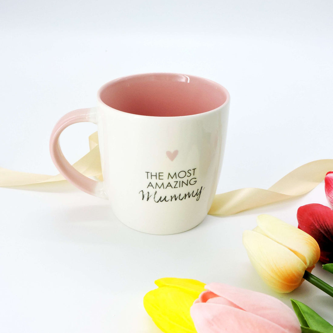 The Most Amazing Mummy Ceramic Mug with pink interior, perfect for gifting, featuring a heartfelt message for morning coffee or evening tea.