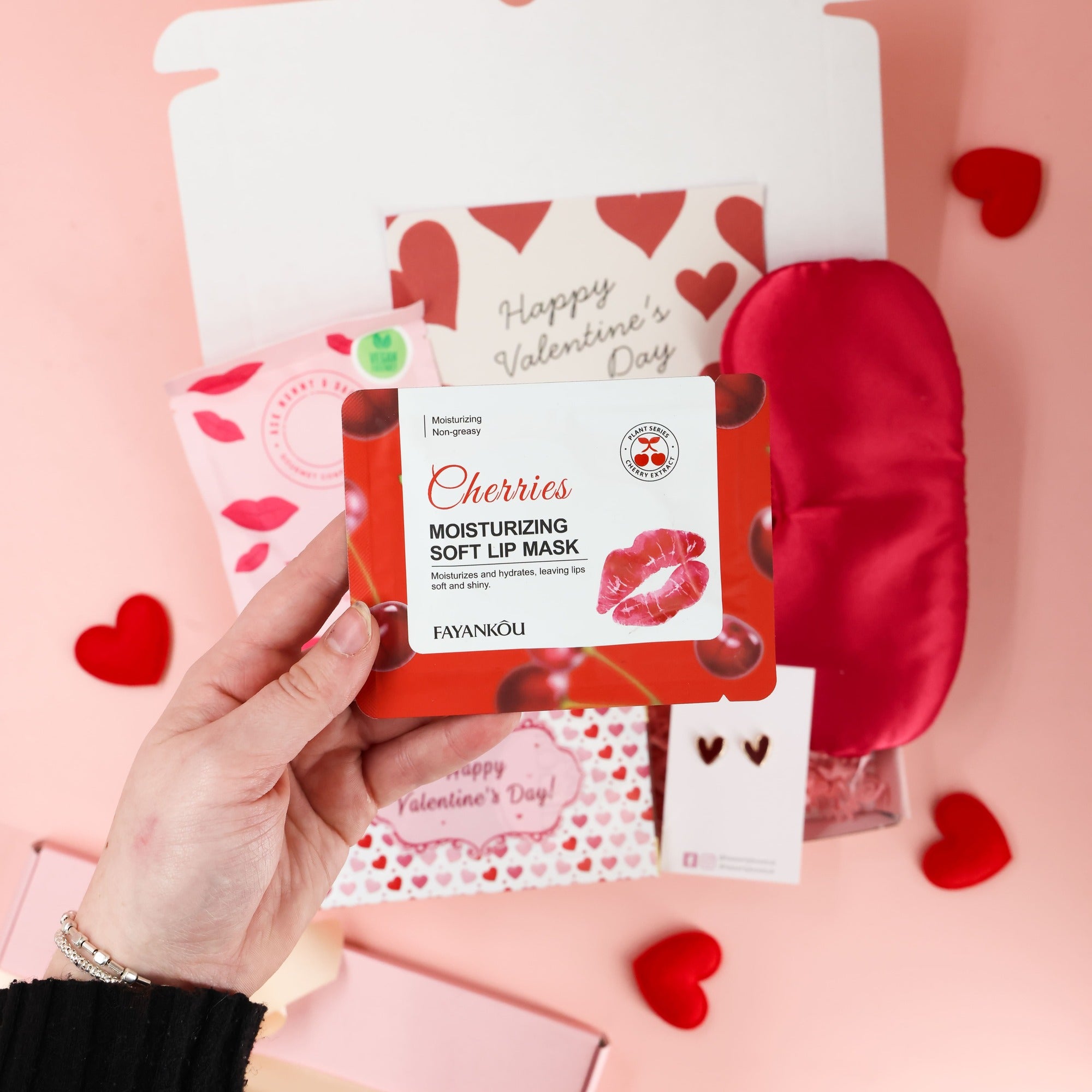 Sweet Kisses valentines gift for her with cosy sleep mask, sweet treats and romantic details displayed inside