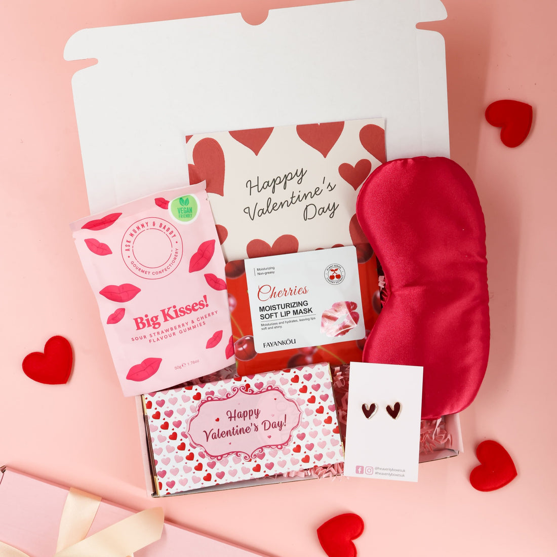 Valentines gift for her featuring pink themed treats, cosy accessories and Valentine’s card