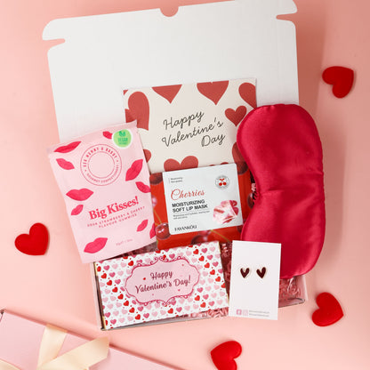 Valentines gift for her featuring pink themed treats, cosy accessories and Valentine’s card