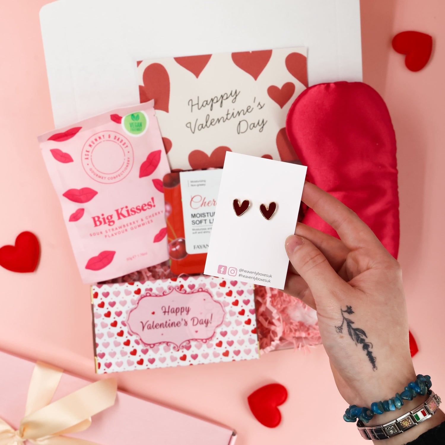 Valentines gift box with strawberry sweets, heart earrings and pampering lip mask