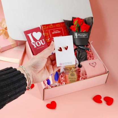 Valentines gift box with pampering eye masks, heart earrings and cosy accessories