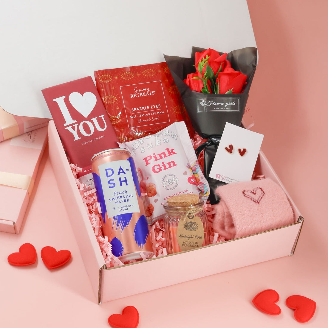 Valentines gift for her featuring chocolate, popcorn, candle and romantic Valentine keepsakes