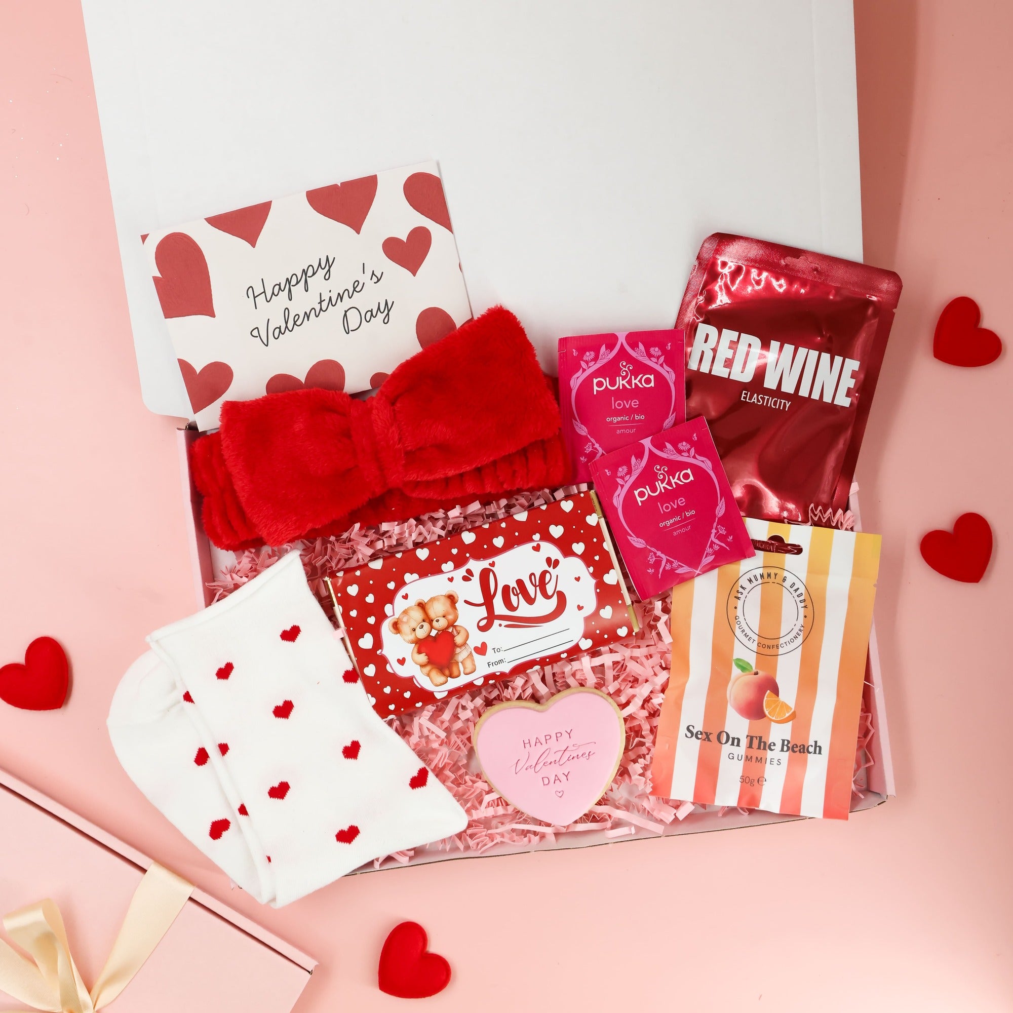 Valentines gift box with relaxing tea, red wine face mask and Valentine themed treats


