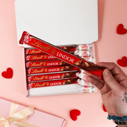 Valentines chocolate gift by Heavenly Boxes styled with indulgent treats and romantic colours
