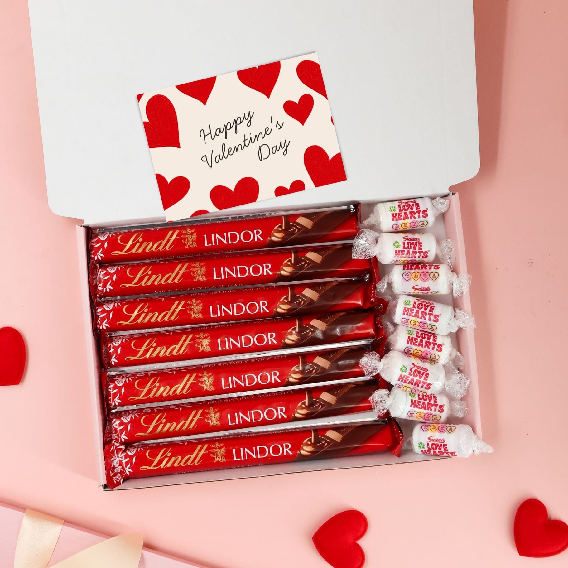 Valentines gift for her chocolate box filled with red wrapped Lindt bars and Valentine sweets