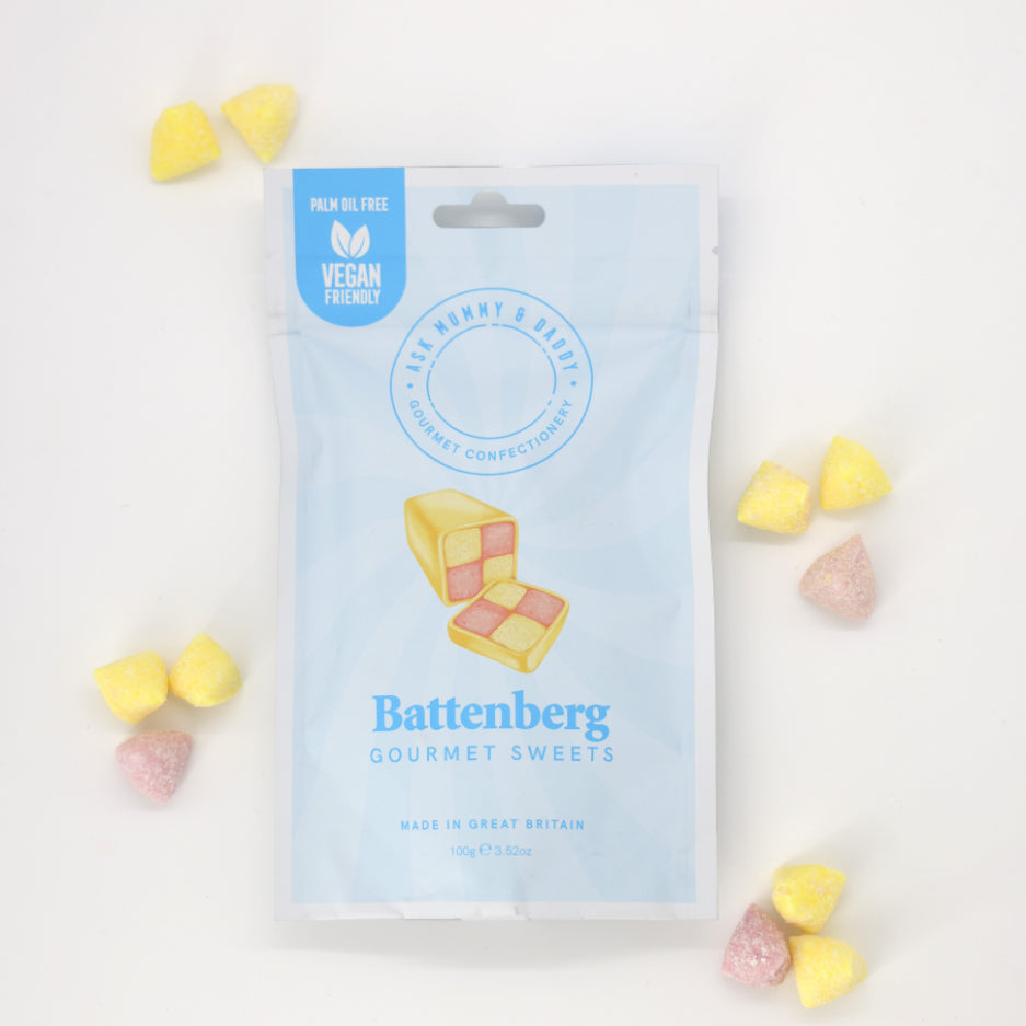 Battenberg Gourmet Sweets in a white bag with blue label, offering vegan, almond-flavored candies inspired by British cake, perfect for gifting or personal enjoyment.