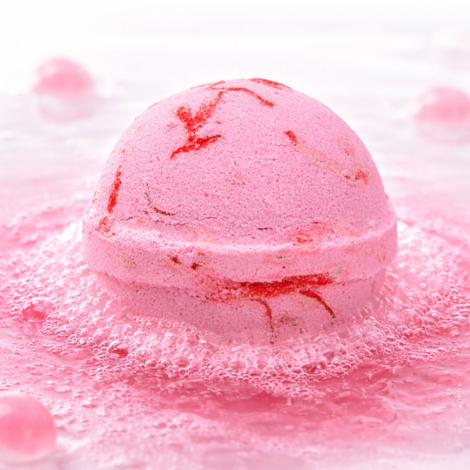 Luxury pink watermelon bath bomb fizzing in water, thoughtful self care gift for her, relaxing pamper treat
