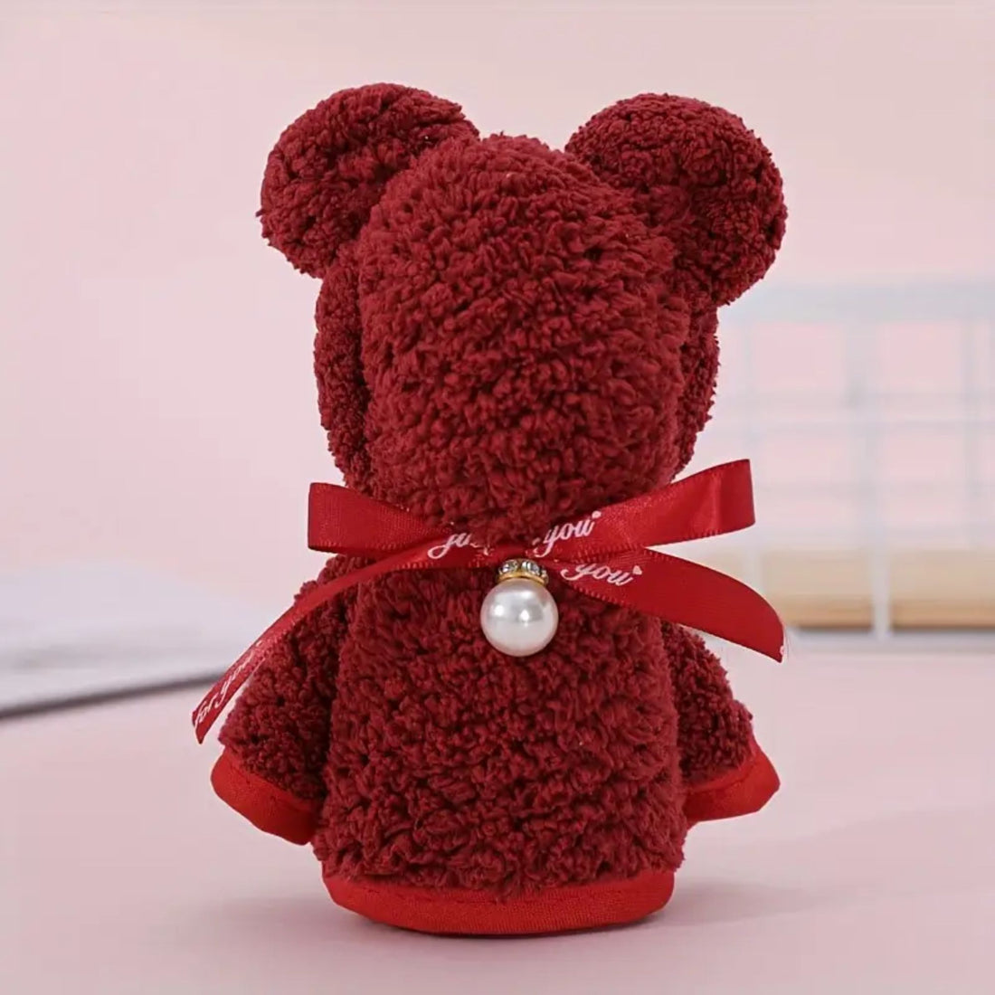 Bear Towel: A charming mini red bear crafted from a soft face towel, featuring a Just For You ribbon and a pearl accent, unfolds into a towel.