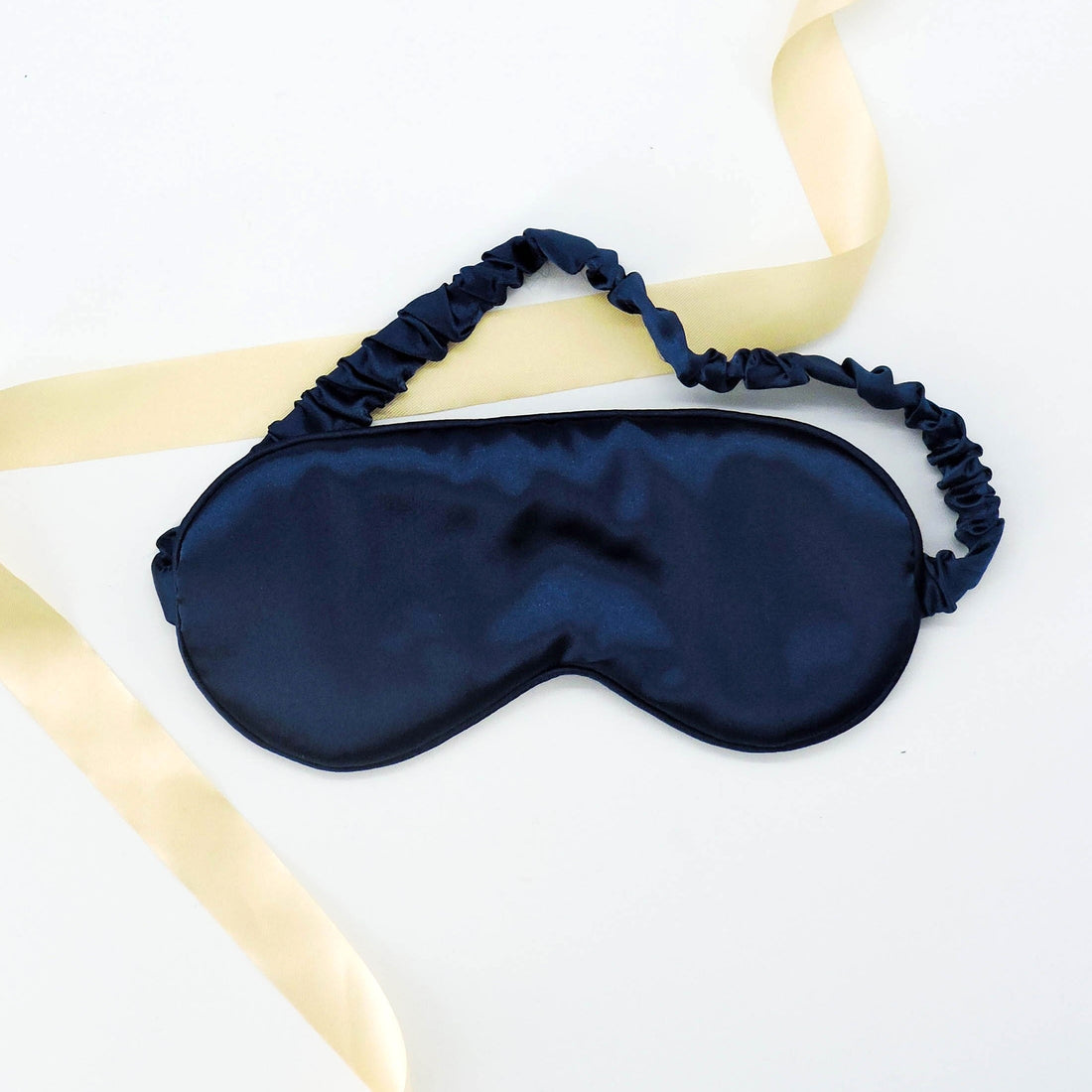 Satin Sleep Mask - Royal Blue, featuring a smooth satin finish and a gold ribbon accent, perfect for adding elegance to any pampering gift.