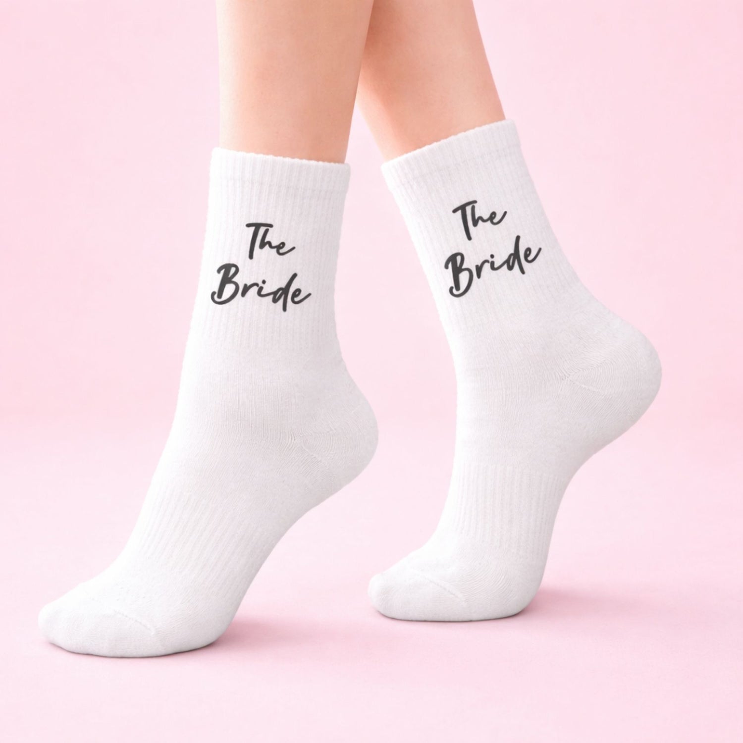 The Bride Socks with black script text, perfect for bridal gifts, featuring elegant design for celebrating the bride-to-be.